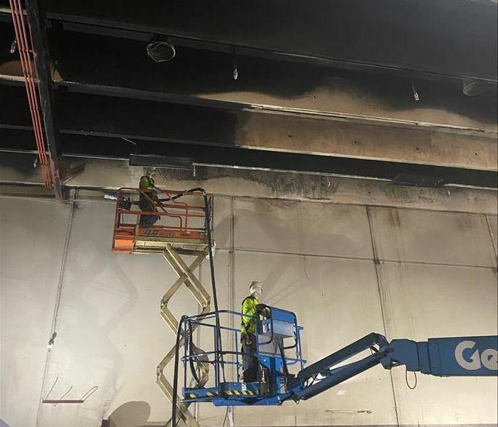 Ice Blasting soot from a ceiling in a boom lift